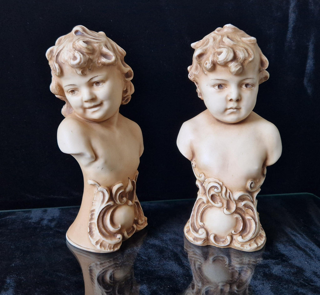 2 Antique Continental Patinated Bisque Porcelain Putti Child Bust Figures 7 inch