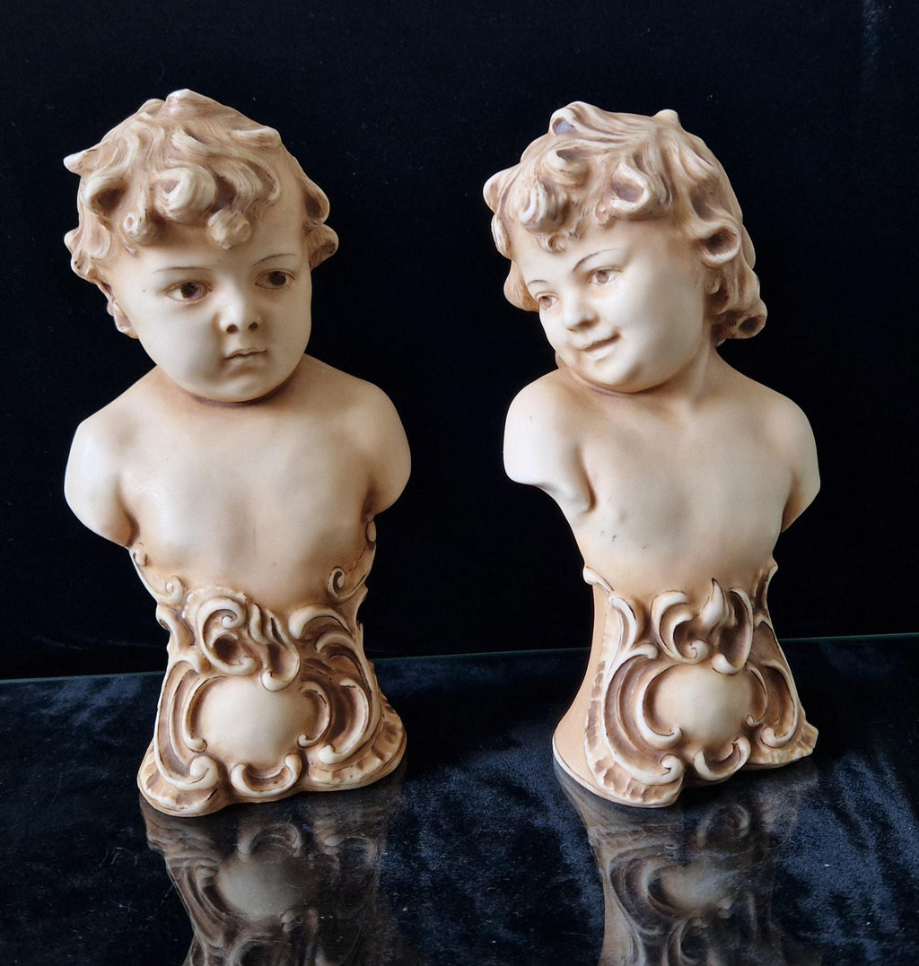 2 Antique Continental Patinated Bisque Porcelain Putti Child Bust Figures 7 inch
