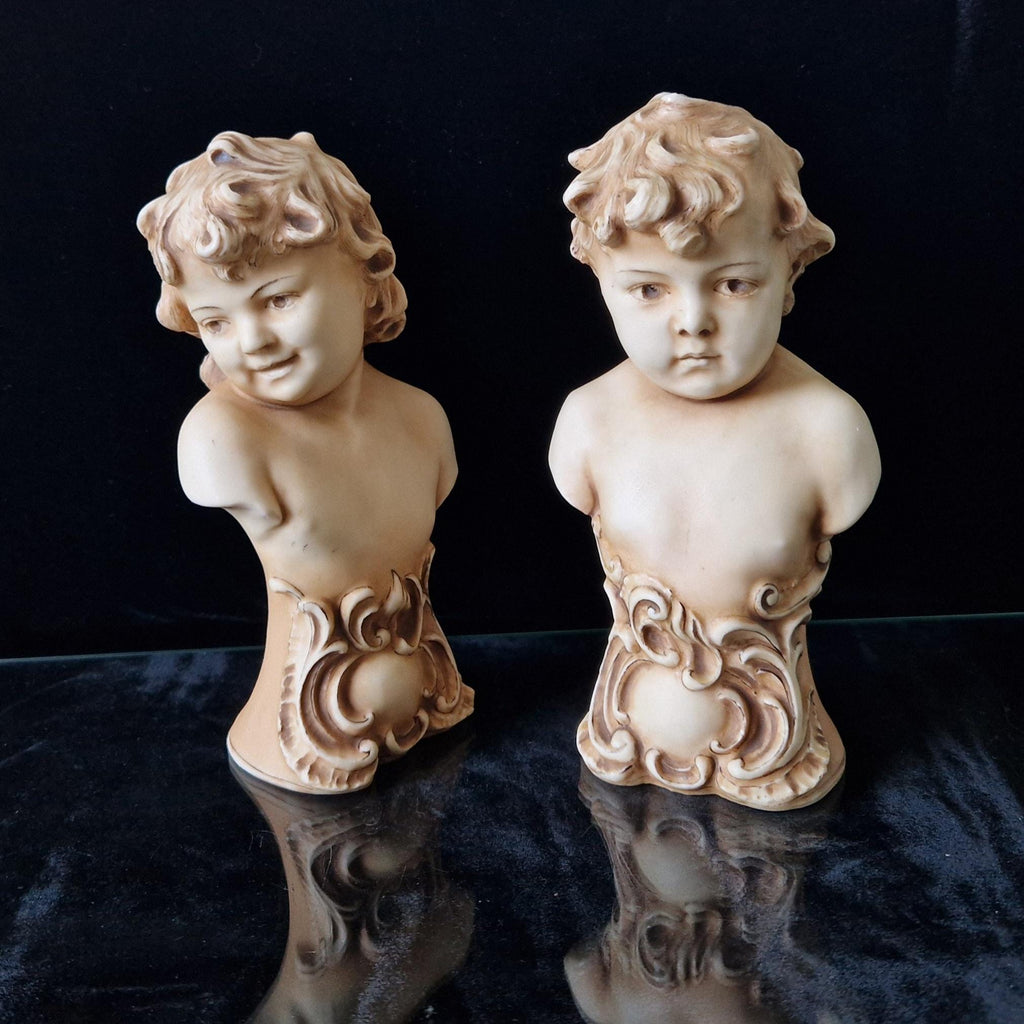 2 Antique Continental Patinated Bisque Porcelain Putti Child Bust Figures 7 inch