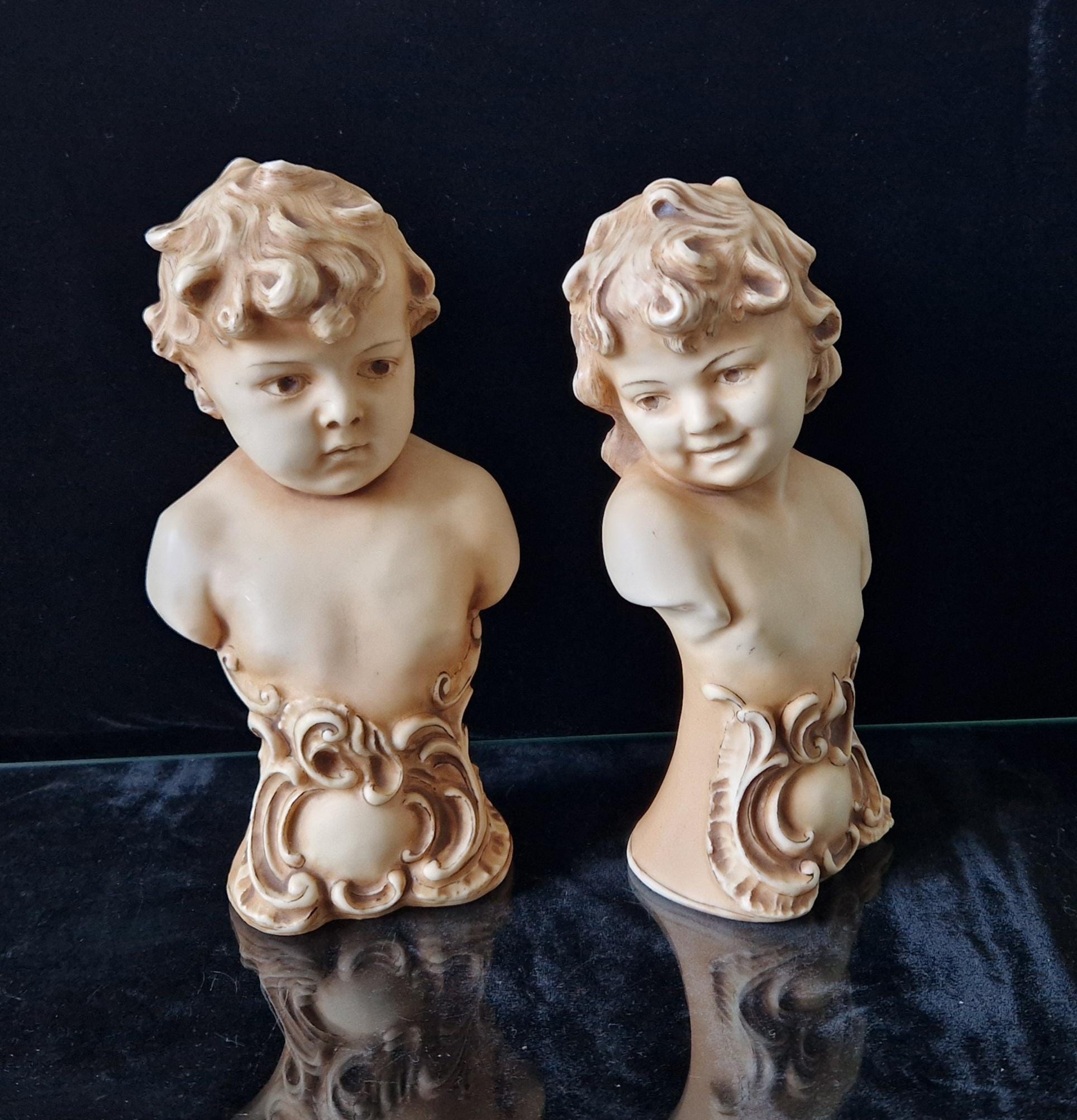 2 Antique Continental Patinated Bisque Porcelain Putti Child Bust Figures 7 inch